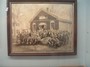 Unidentified group photo of years gone by infront of the Little Red School House.